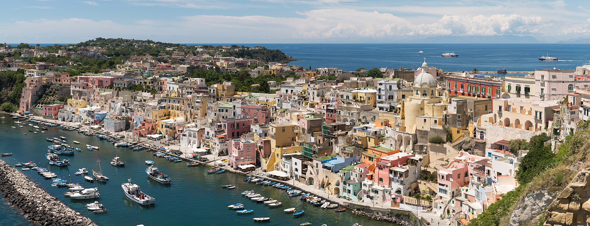 The pastel harbor of Corricella on Procida, in the Bay of Naples
